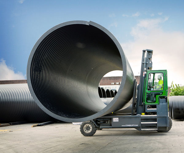 Combilift C Series forklift moving a large pipe